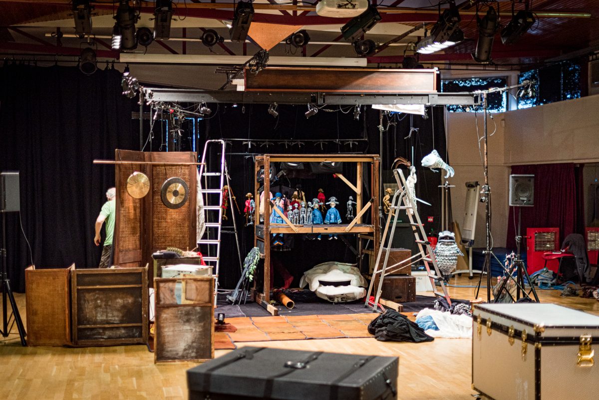 A set filled with ladders and puppets